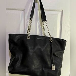 Black leather Michael Kors handbag.